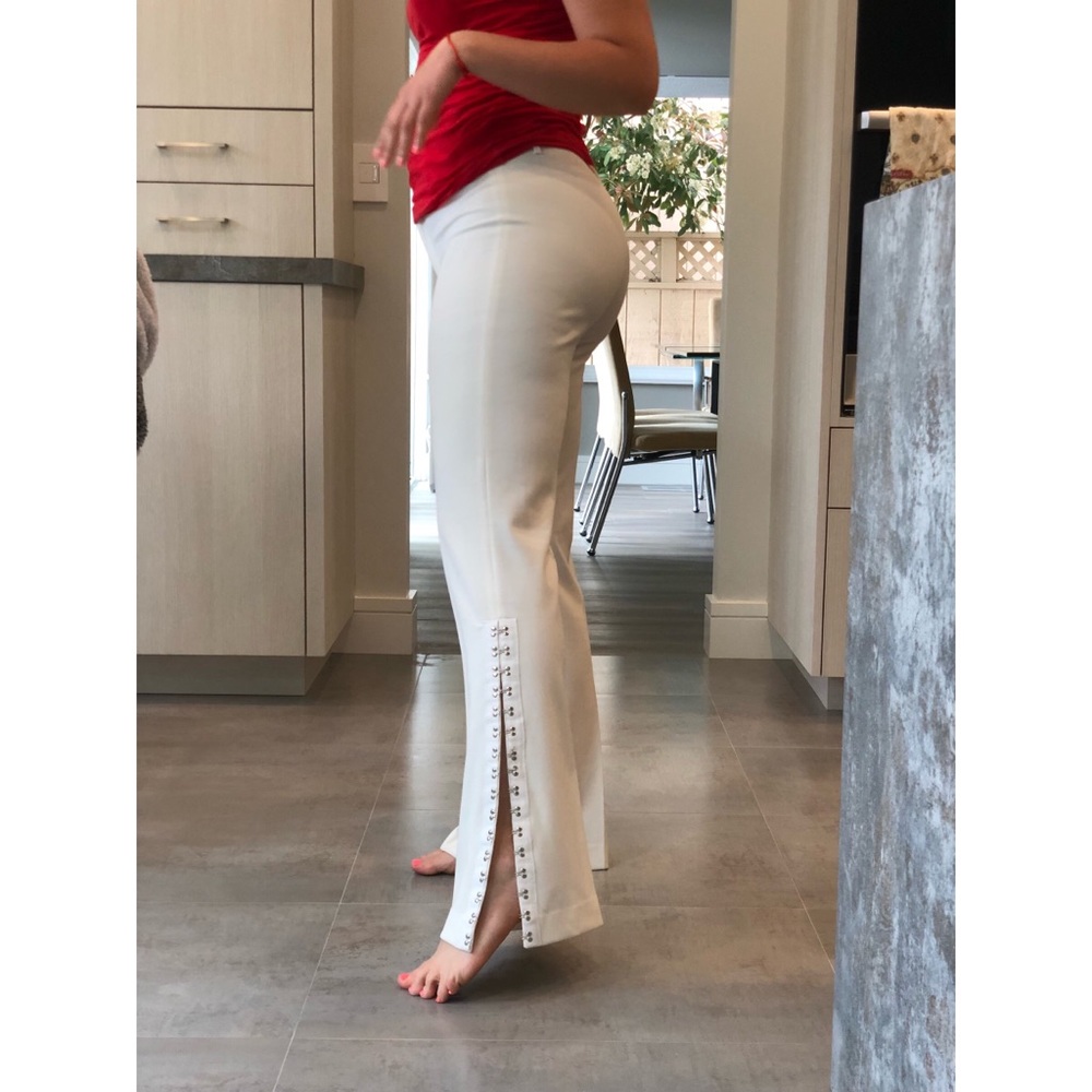 Cream pants with metal hooks